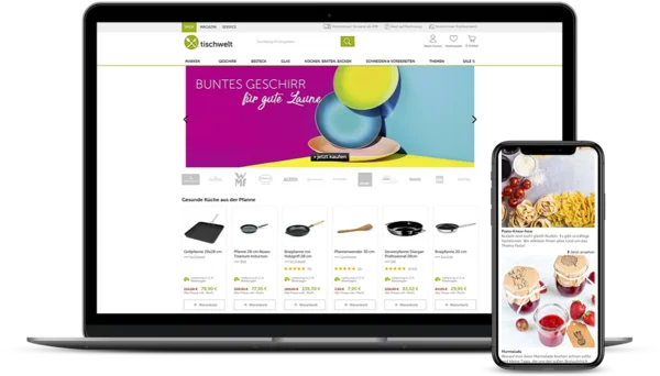 Website-Design auf Laptop und Smartphone mit buntem Geschirr, Pfannen, nudeln und Marmeladen im Onlineshop.