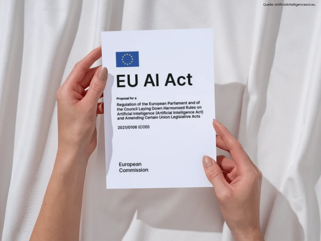 Person hält Dokument mit der Aufschrift "EU AI Act" und EU-Flagge.