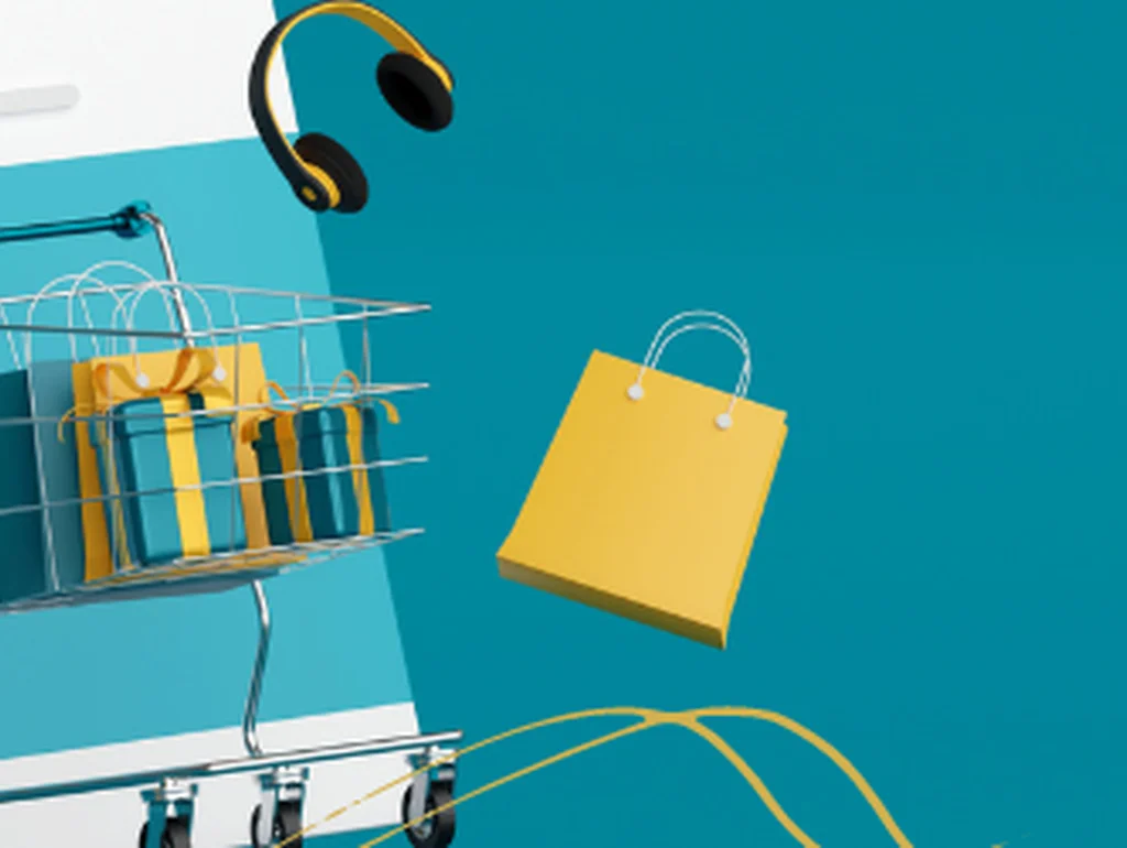Einkaufskomposition mit Koffer, Warenkorb und Einkaufstaschen vor einem blauen Hintergrund, symbolisiert Online-Shopping.
